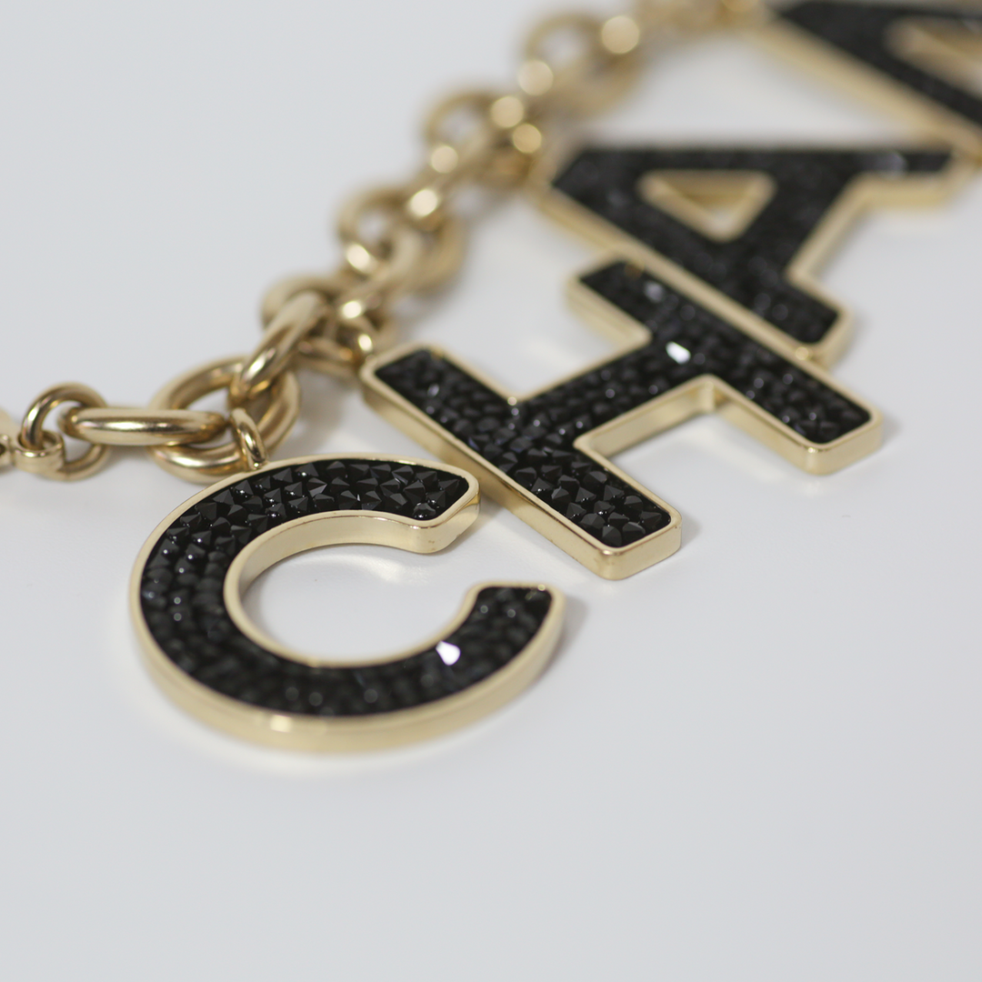 Chanel Black Crystal-Encrusted Letters Gold Chain Charm Bracelet