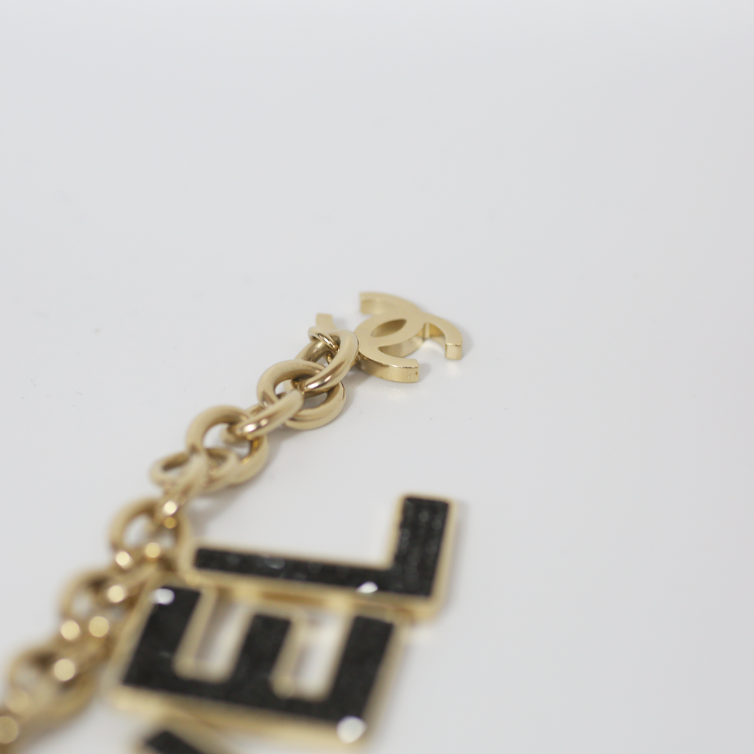 Chanel Black Crystal-Encrusted Letters Gold Chain Charm Bracelet