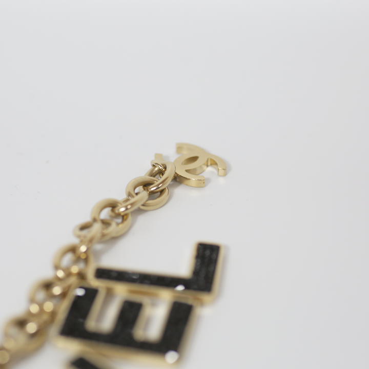 Chanel Black Crystal-Encrusted Letters Gold Chain Charm Bracelet