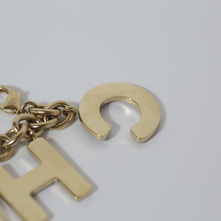 Chanel Black Crystal-Encrusted Letters Gold Chain Charm Bracelet