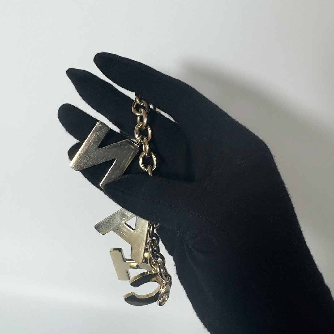 Chanel Black Crystal-Encrusted Letters Gold Chain Charm Bracelet