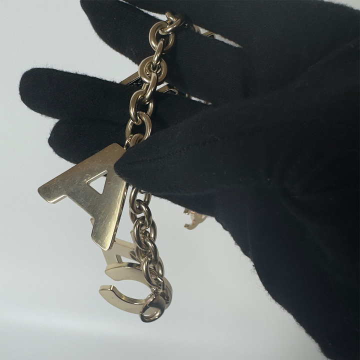Chanel Black Crystal-Encrusted Letters Gold Chain Charm Bracelet