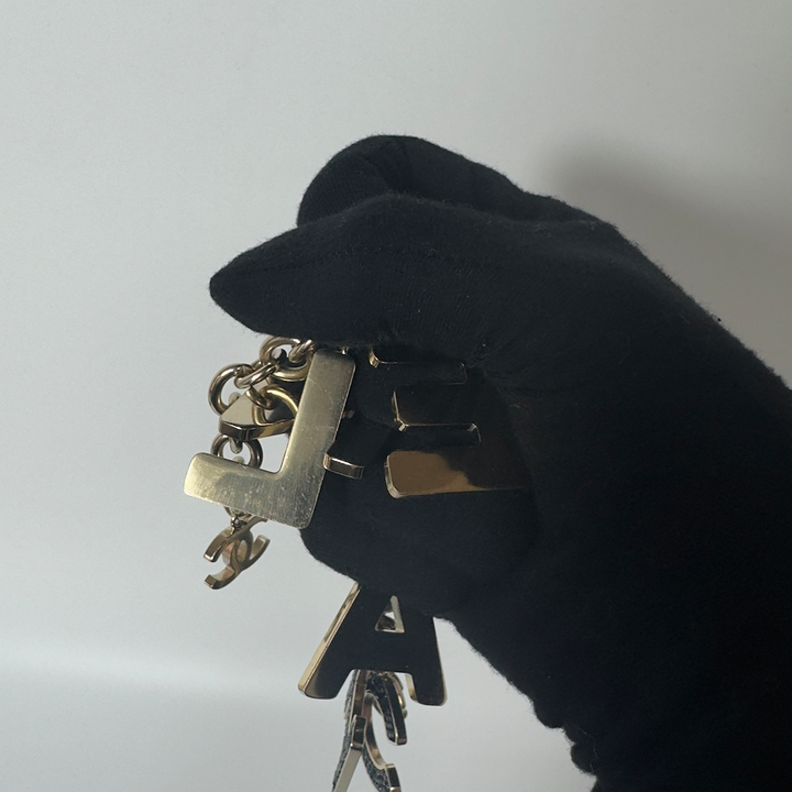 Chanel Black Crystal-Encrusted Letters Gold Chain Charm Bracelet