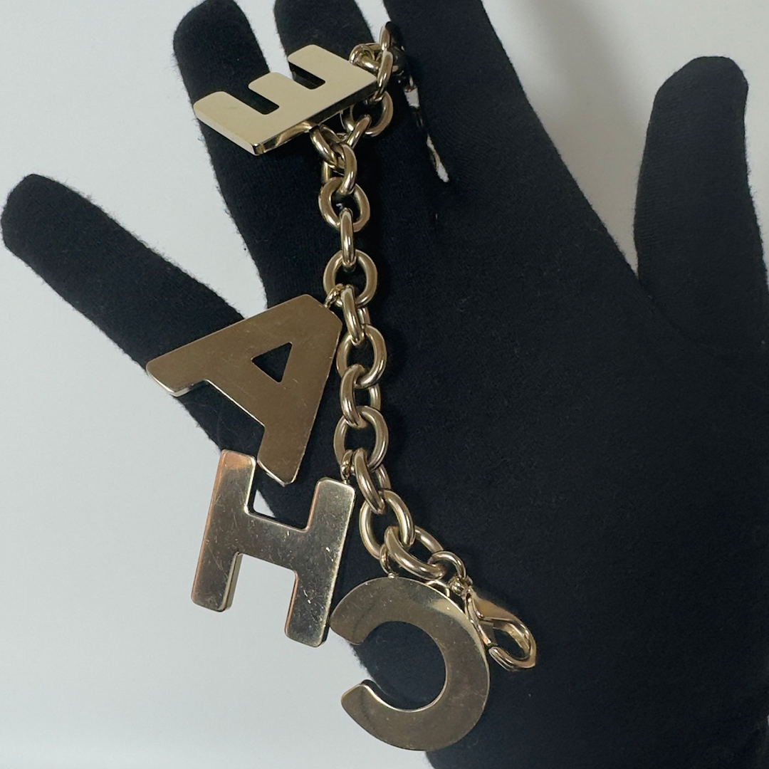 Chanel Black Crystal-Encrusted Letters Gold Chain Charm Bracelet