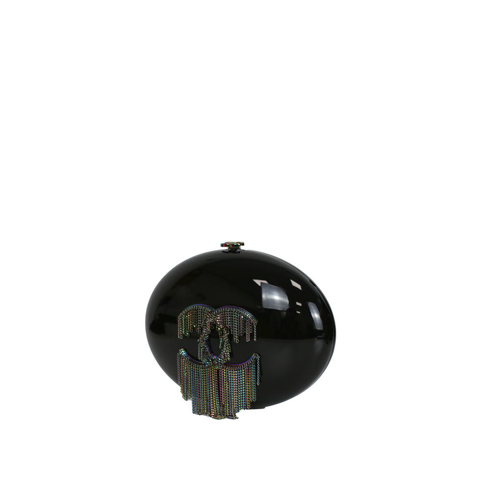 This minaudiere features a shiny black plexiglass finish.