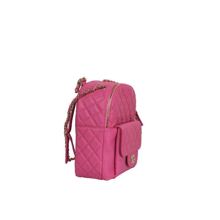 This Chanel backpack features a front flap slip pocket, and a zip closure main compartment.