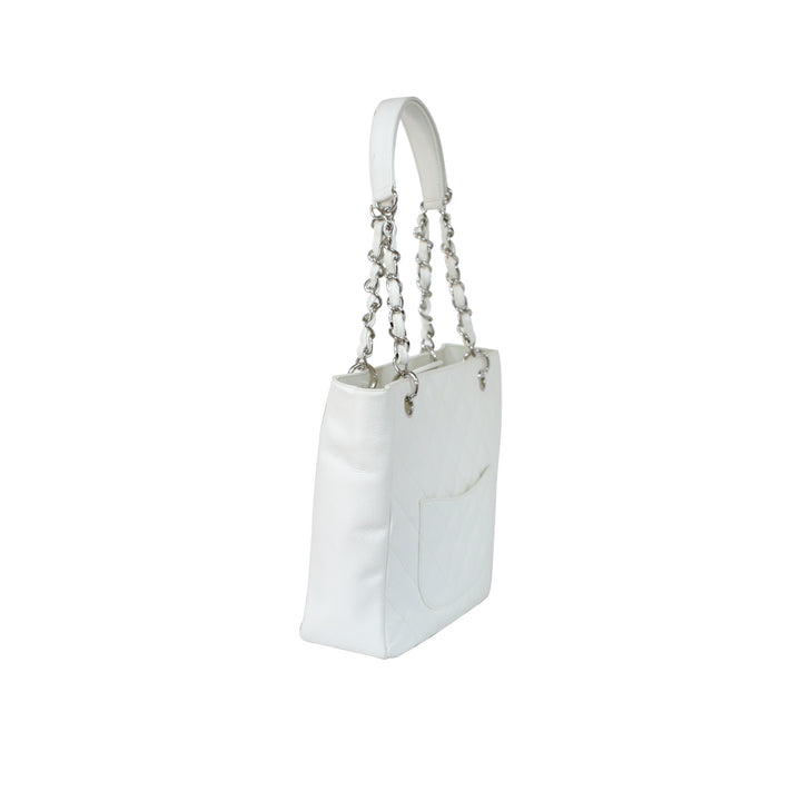 The handbag features the iconic Chanel quilted caviar leather.