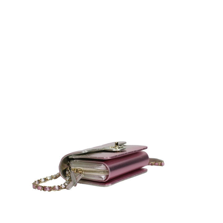 This Chanel bag features a turn-lock and a zip closure with multiple compartments for storing your essentials.