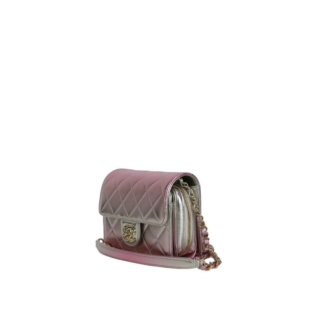 This Chanel handbag features a front flap, and a shoulder strap pad.