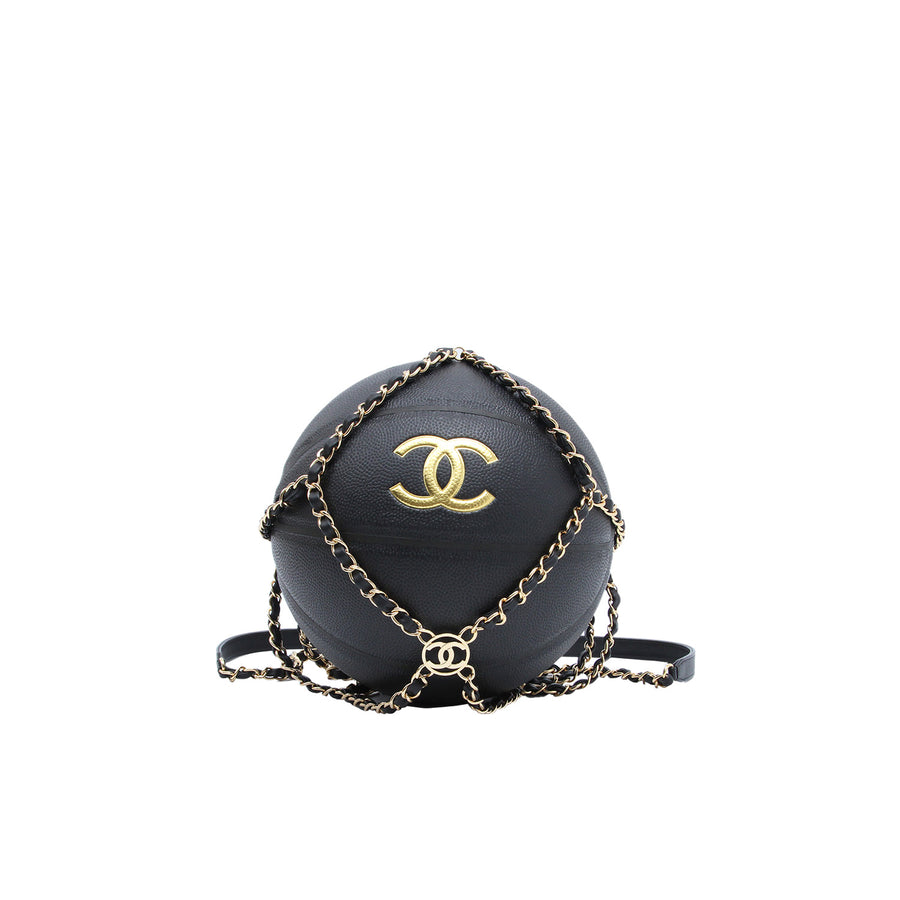 A Chanel basketball with gold-toned CC logo inside the interwoven chain and leather net with a shoulder strap.