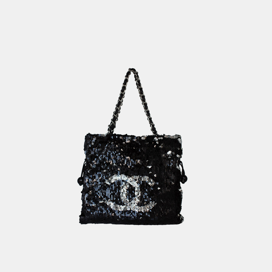 Chanel sequin drawstring shoulder bag in black and silver, with silver-toned hardware.