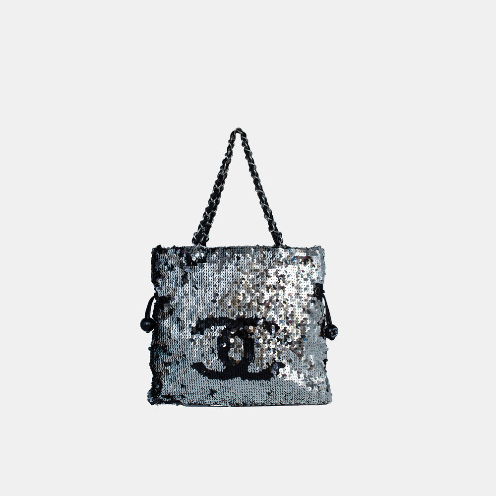 This Chanel shoulder bag features a sequin exterior with a CC logo.