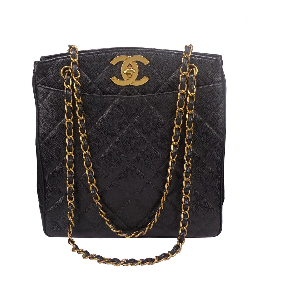 Vintage Chanel shoulder tote in caviar leather and 24k gold-plated hardware.