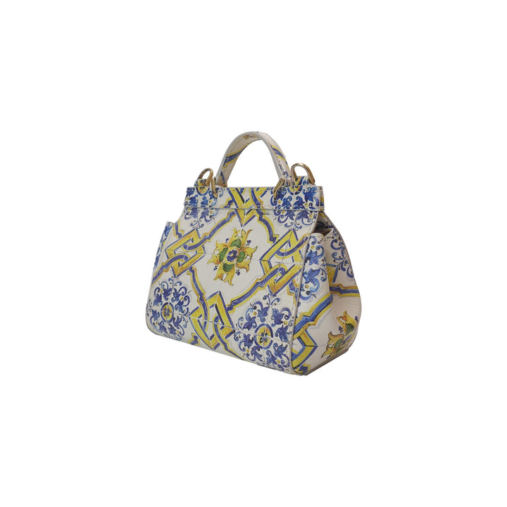 The left side of the handbag with blue and yellow floral pattern.