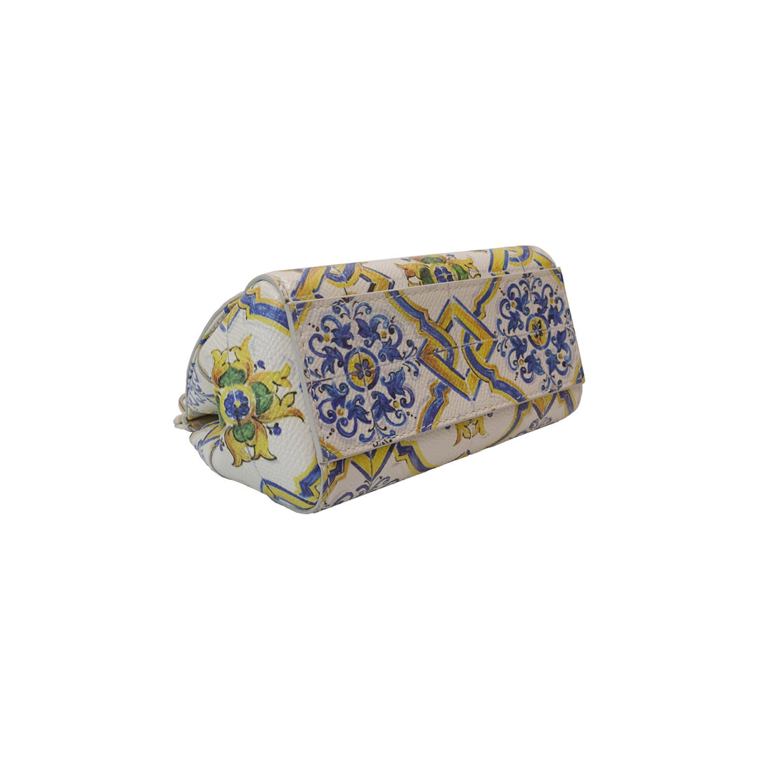 The bottom of the handbag with the decorative print.