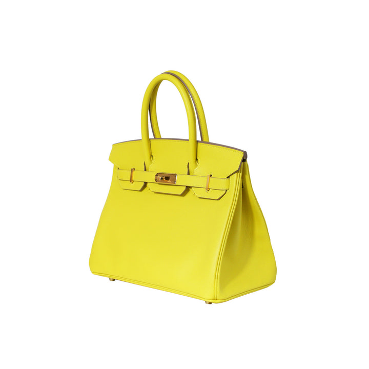 The handbag is in the colour lime yellow.