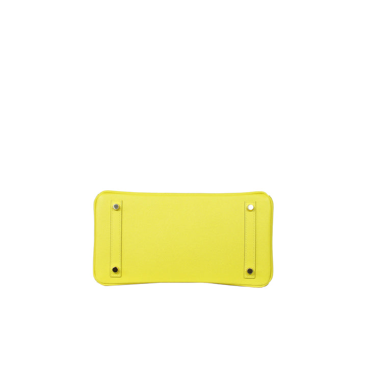 The bottom of the handbag with 4 protective feet hardware.