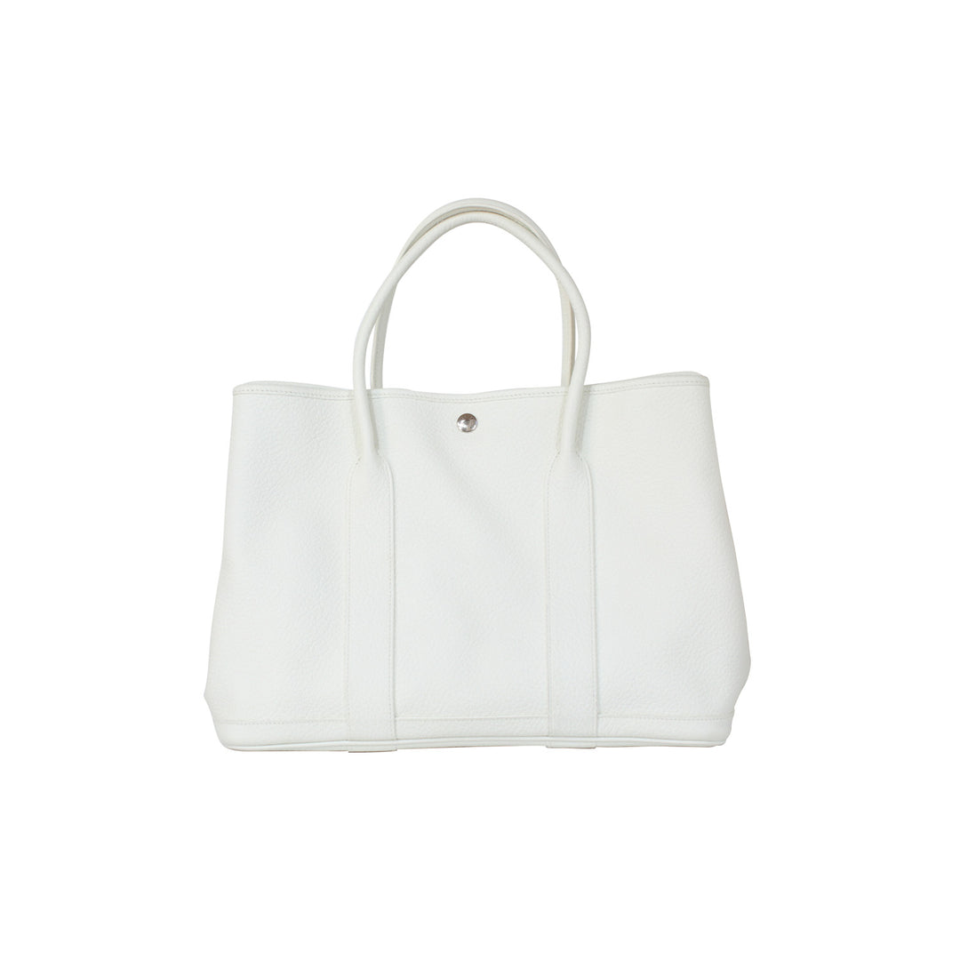 Hermès Garden Party 36 PM in white with silver-toned hardware.