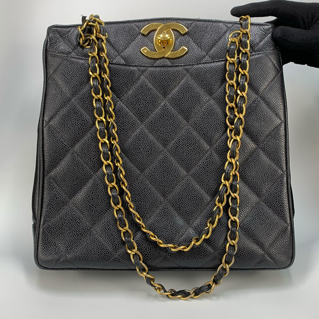 The front of the bag with the CC turn-lock,  the leather chain shoulder straps, and the slip pocket.