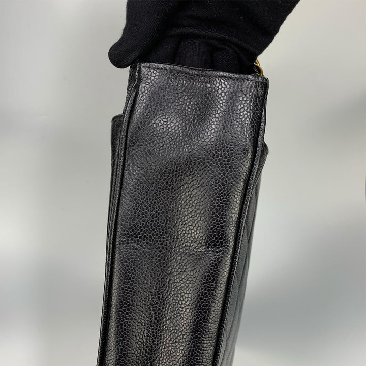 The pebbled texture of the caviar leather.