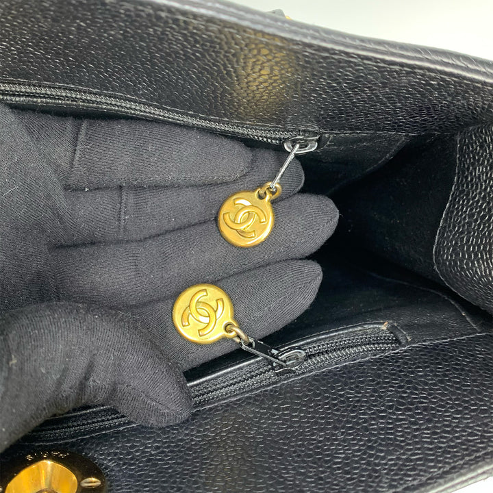 There are two zipper pull charms with CC logo.