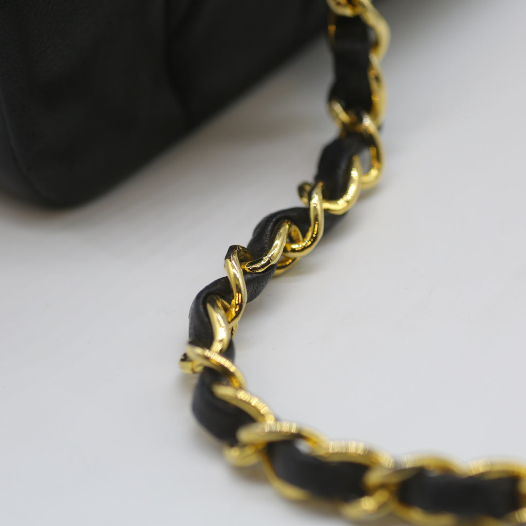 A close-up of the shiny gold-plated hardware.