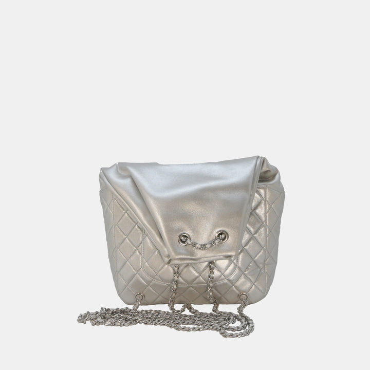 This backpack features a interwoven leather and chain backpack strap.