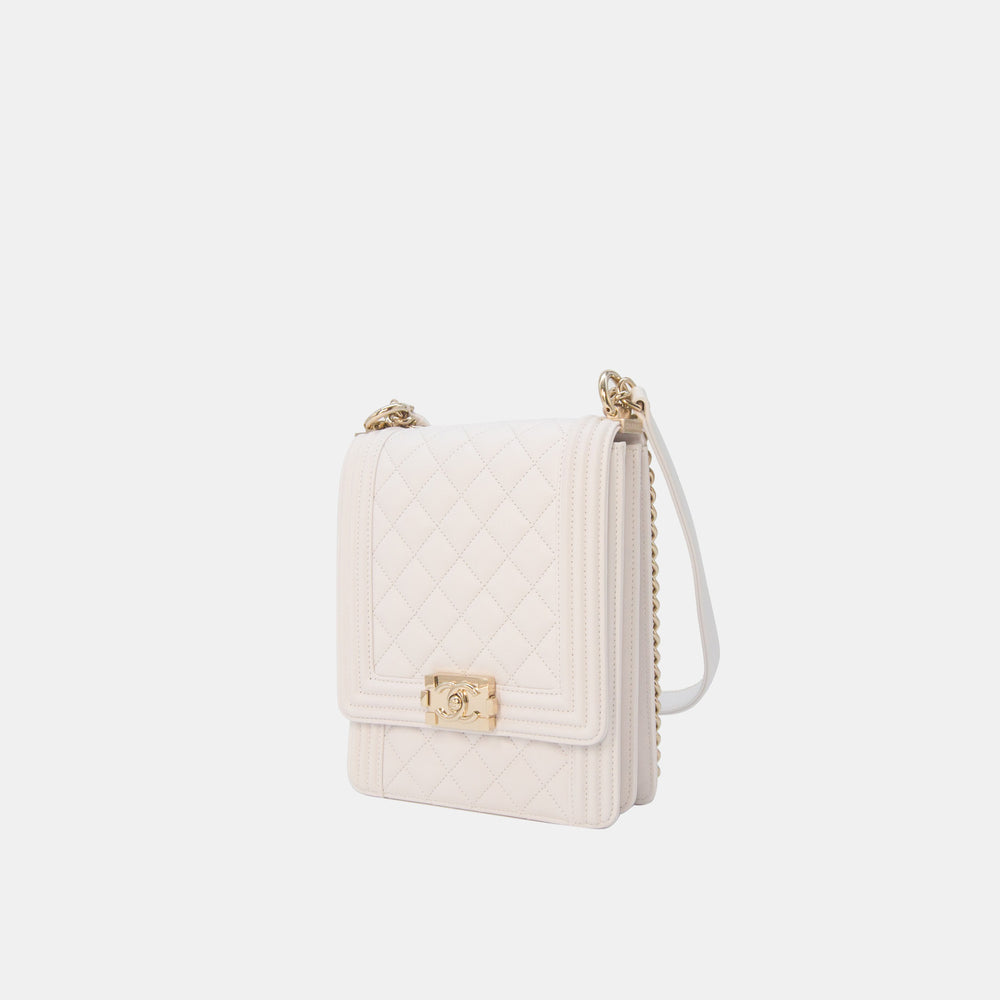 This handbag features a Chanel logo push lock closure.