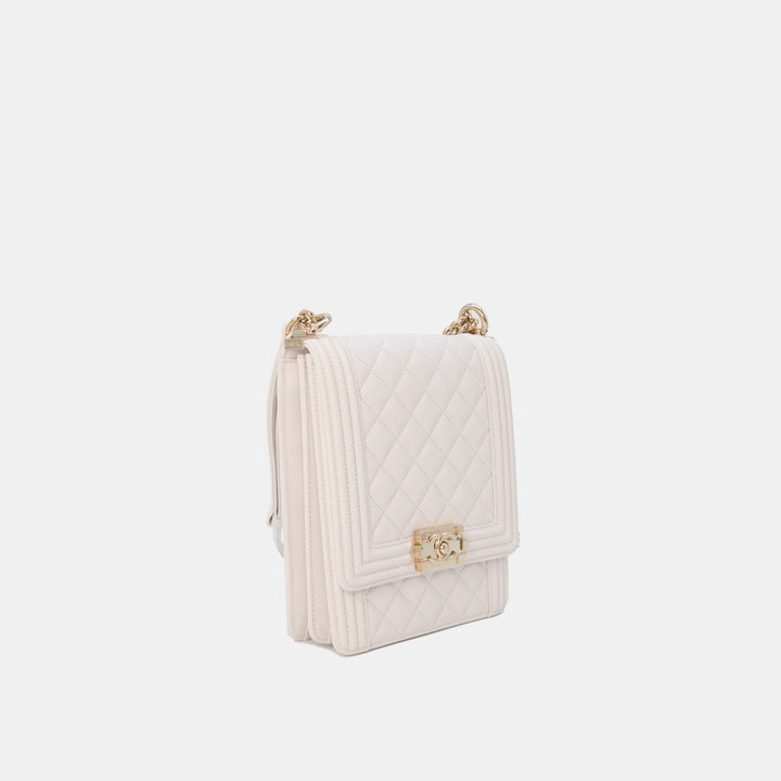 This handbag features a chan and leather strap for shoulder or crossbody wear.