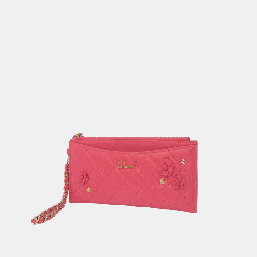 This Chanel wallet features leather Camellia flowers on the front.