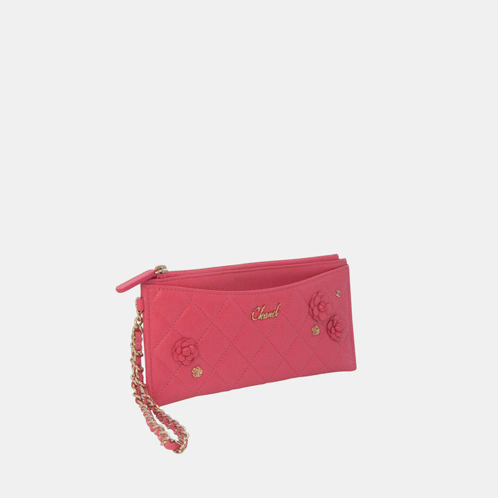 This Chanel wallet features a zipper closure, a front slip pocket, and a chain strap.