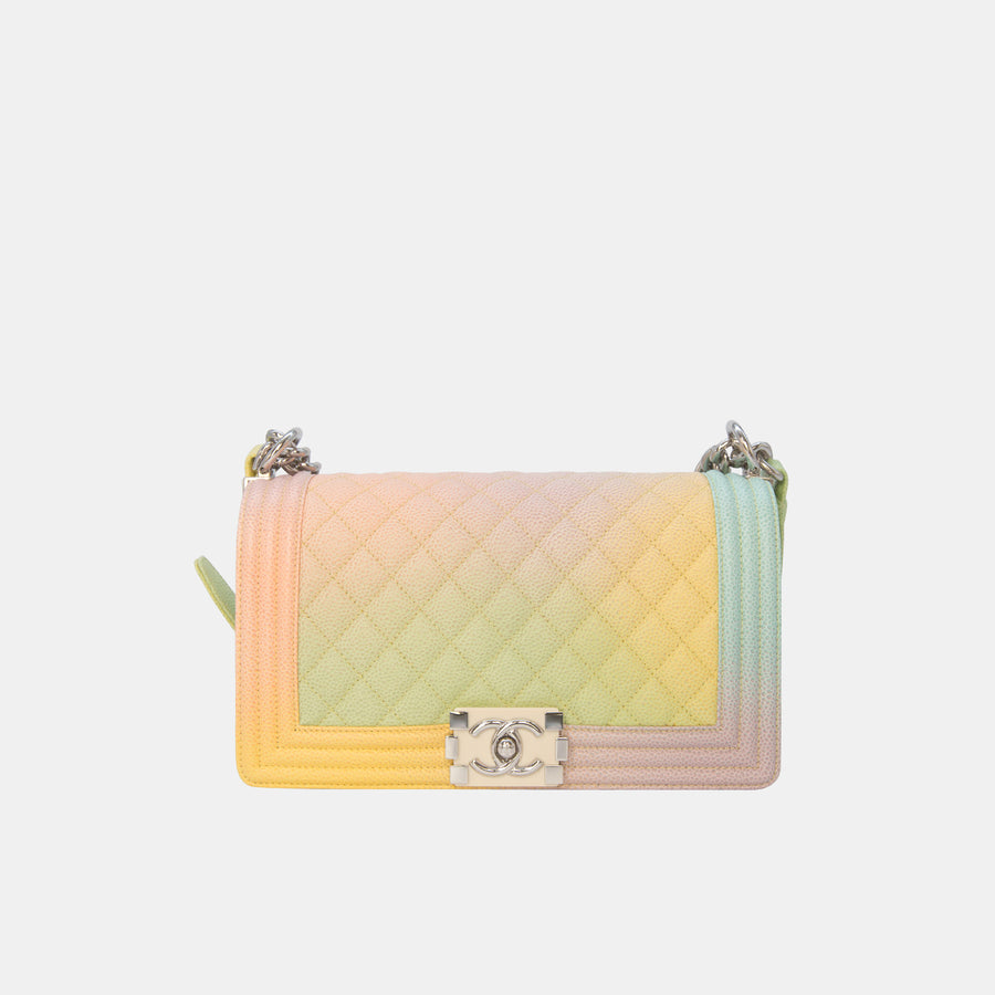 A Chanel Rainbow Boy Medium handbag in multicolor caviar leather with silver hardware, featuring the brand's iconic quilting and a silver-toned push lock closure.