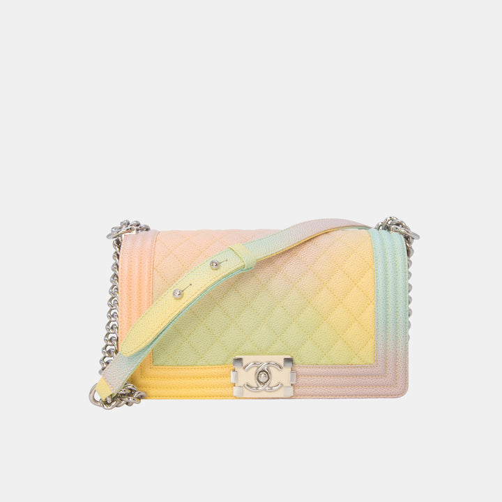This Chanel Boy bag features a chain and leather adjustable strap.