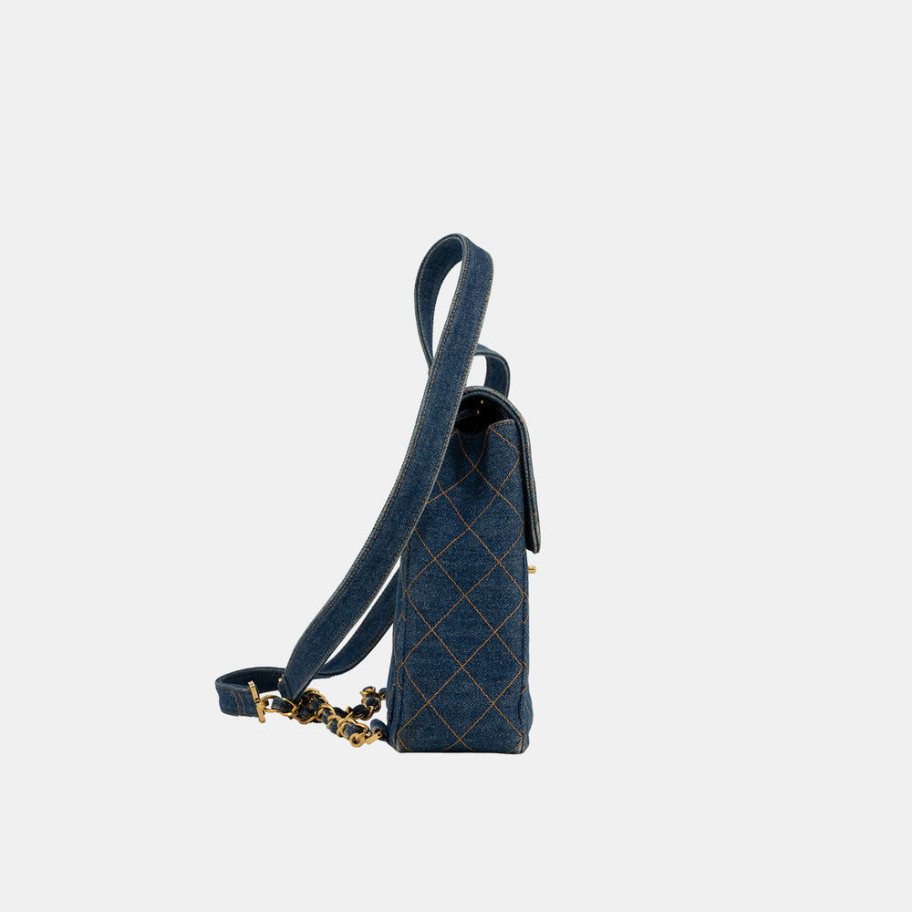 The side of the Chanel Vintage Denim Flap Backpack.