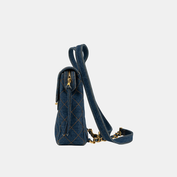 The side of the Chanel Vintage Denim Flap Backpack.