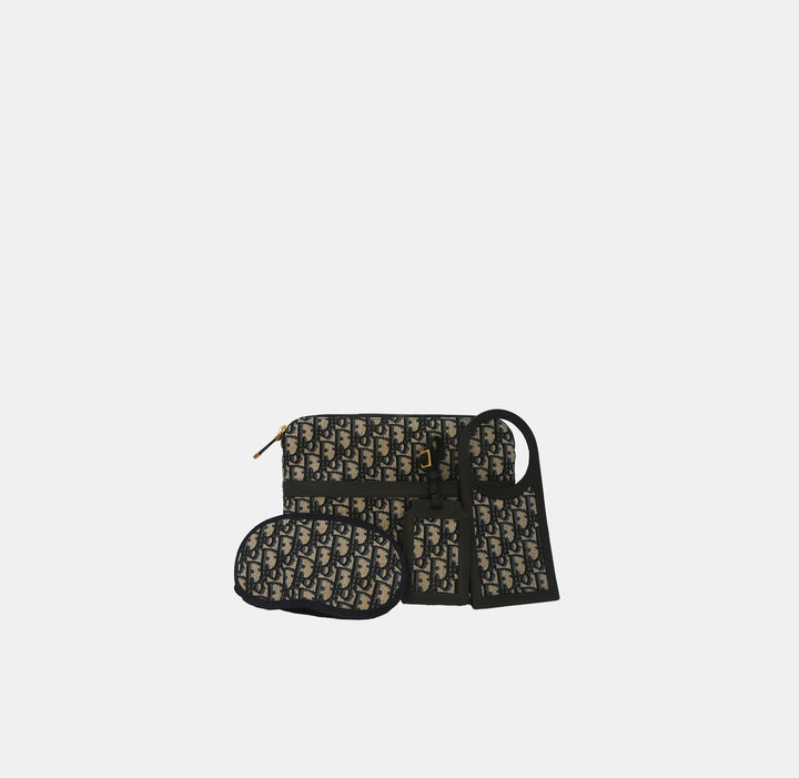 Dior Blue Oblique Canvas Travel Set with eye mask, luggage tag and do not disturb tag.