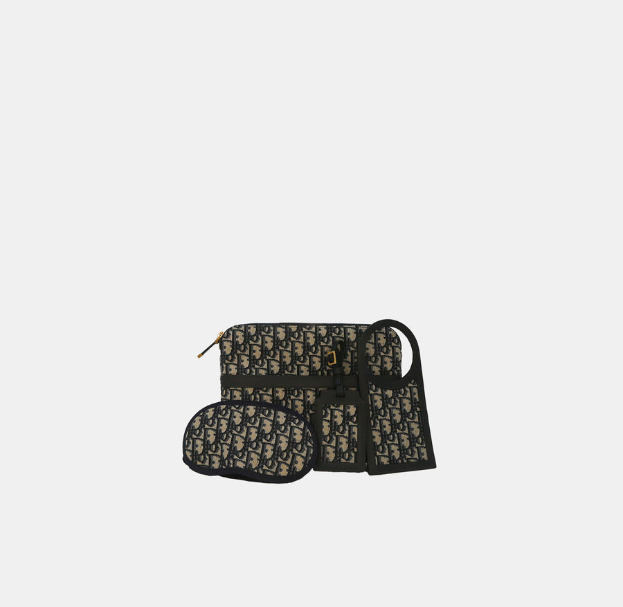 Dior Blue Oblique Canvas Travel Set with eye mask, luggage tag and do not disturb tag.