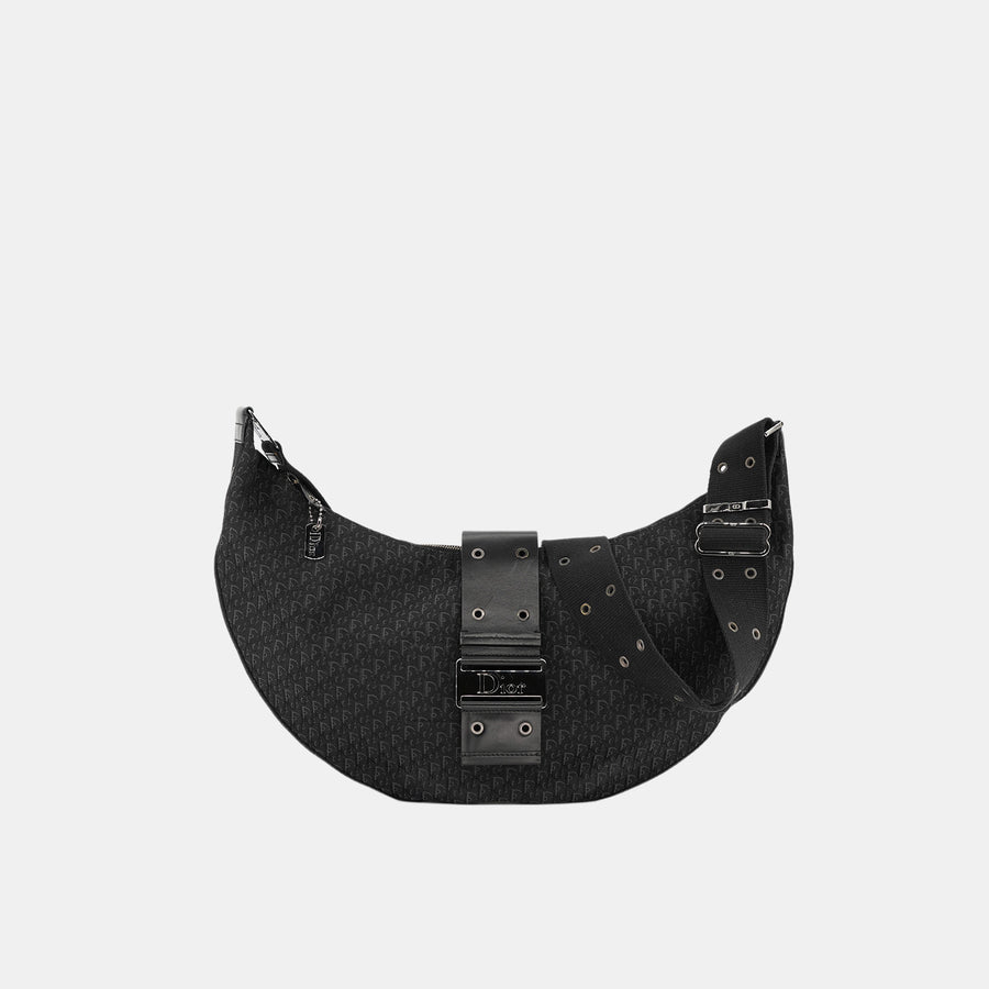 Vintage Dior half-moon crossbody bag in black oblique canvas.