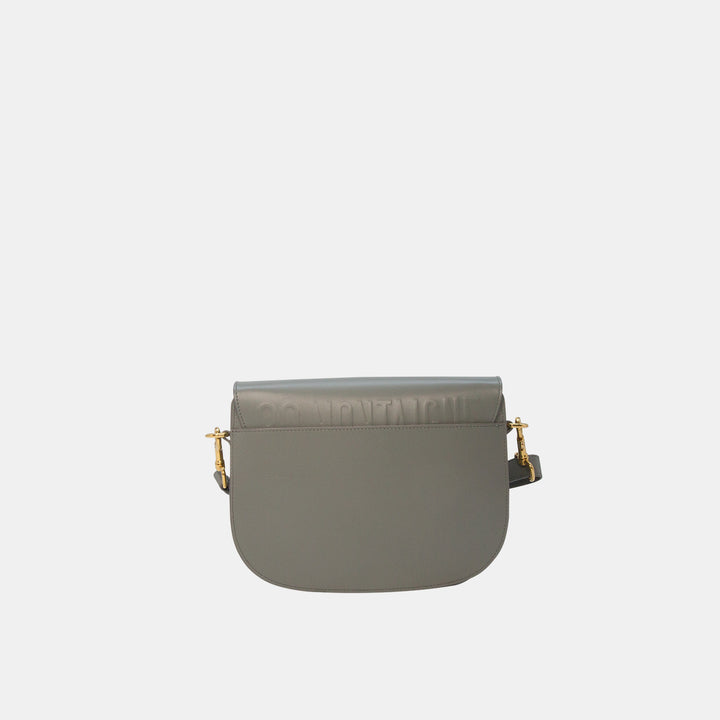 This crossbody bag features a rounded satchel shape, and has Dior’s 30 Montaigne Paris address hand-embossed on the back.