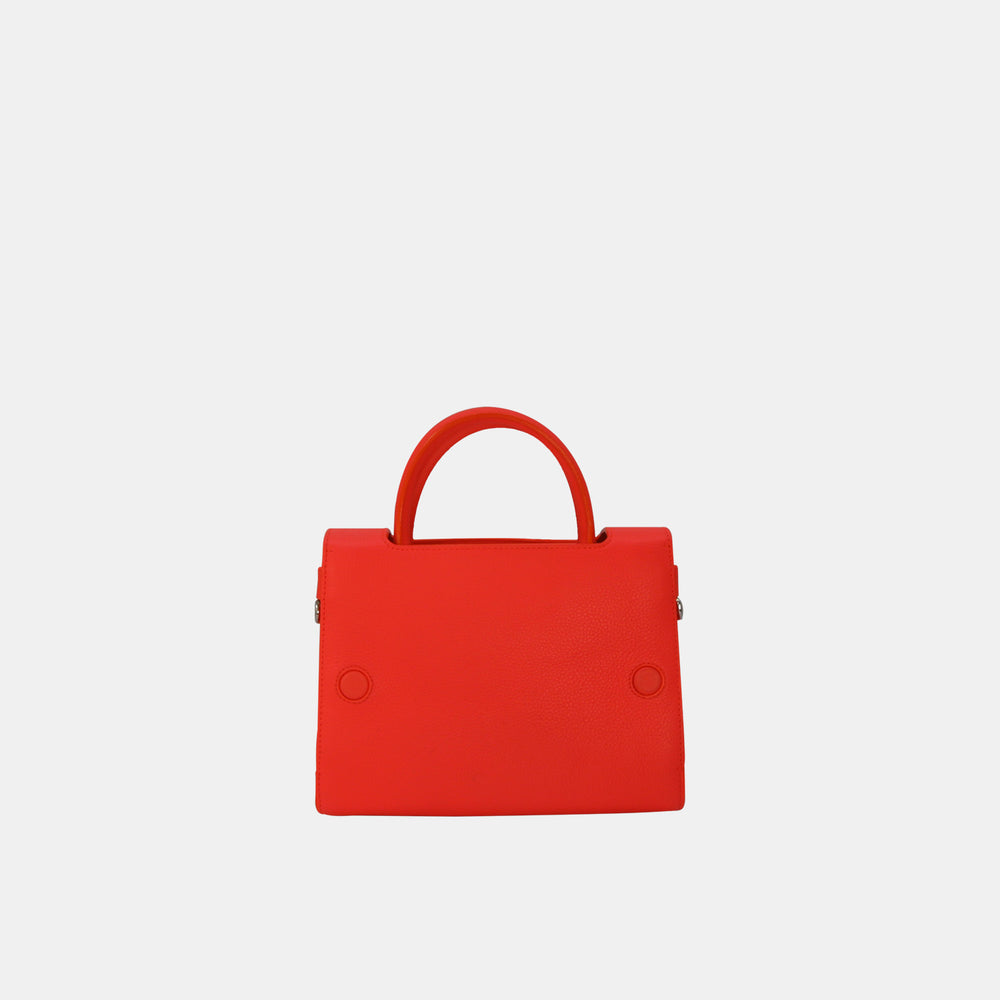 This Dior bag features two rolled leather top handles.