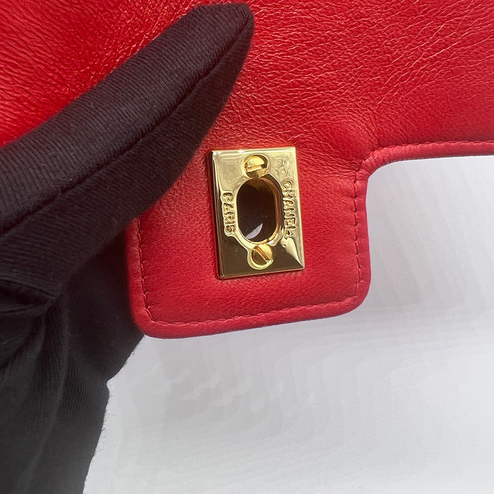 On the back of the CC turn-lock, there is a CHANEL and a PARIS engraving on it.