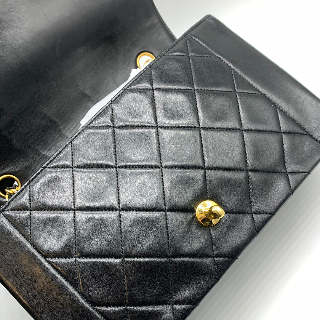 The main bag under the flap with Chanel diamond quilting.