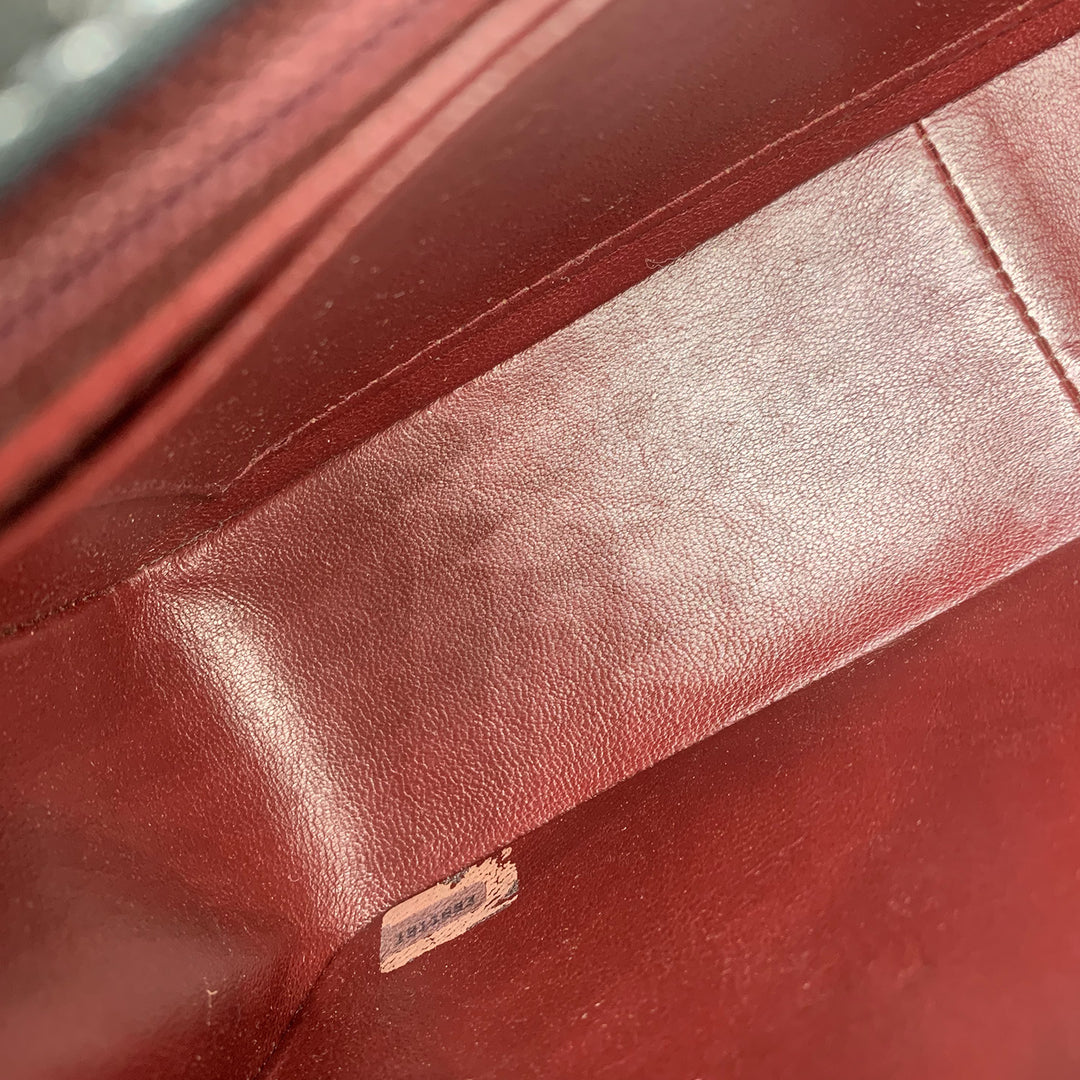 The Chanel serial number sticker inside the bag.