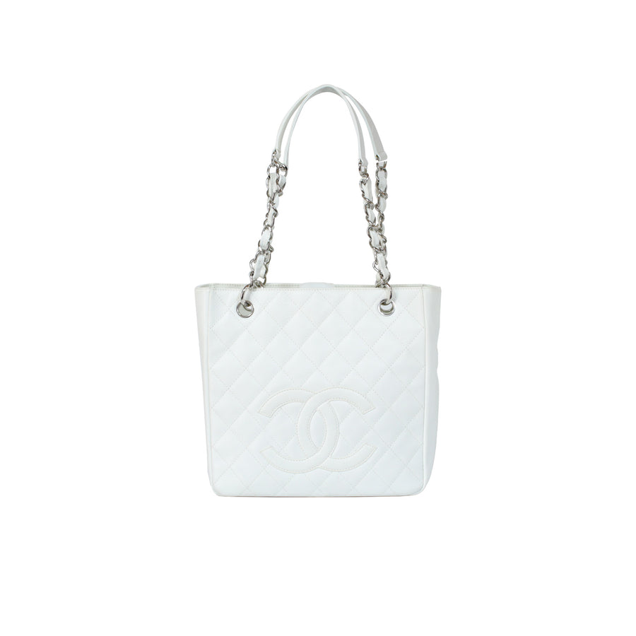 Chanel petite shopping tote bag in white caviar leather with silver-toned hardware. 