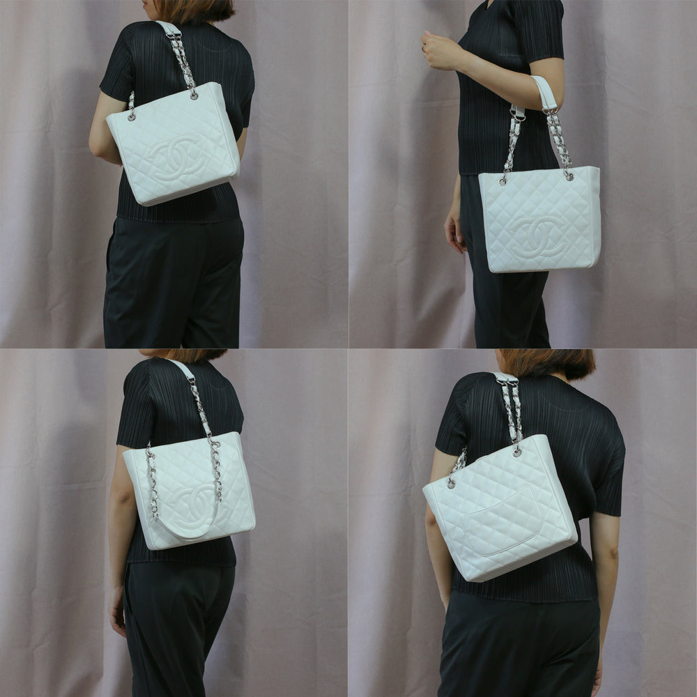 Model carrying the handbag with its chain and leather straps, as a top-handle bag and a shoulder bag. 