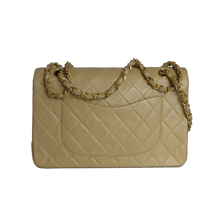 This vintage Chanel bag features a back slip pocket for your essentials. 