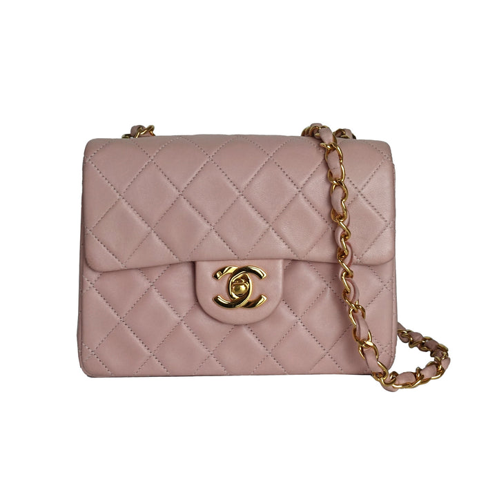 Vintage Chanel pink lambskin mini square flap bag with 24k gold-plated hardware.