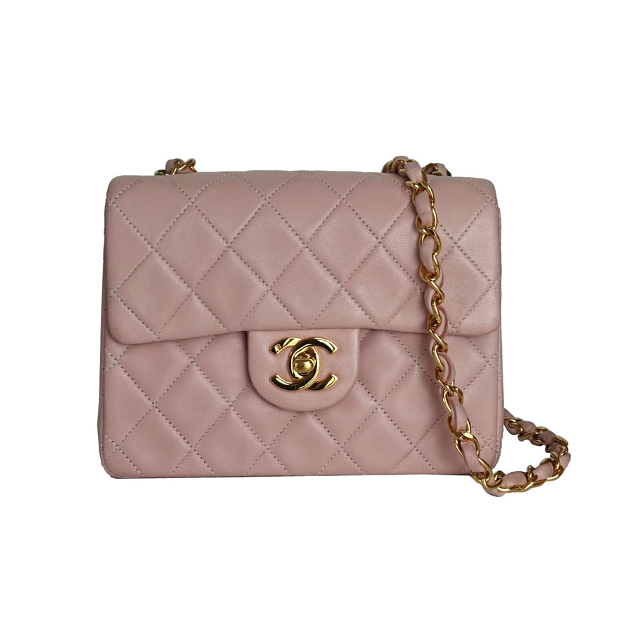 Vintage Chanel pink lambskin mini square flap bag with 24k gold-plated hardware.