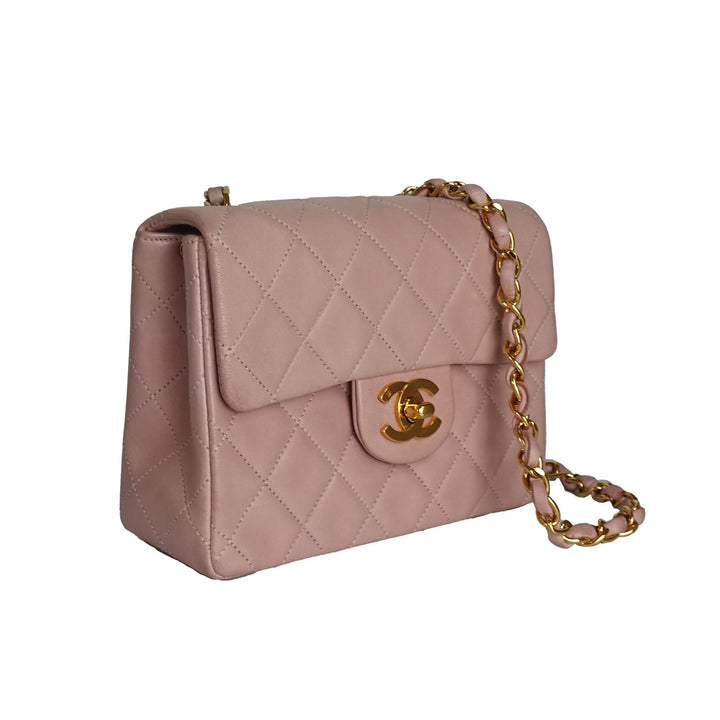 This vintage Chanel bag features 24k gold-plated hardware on the CC turnlock, and the interwoven chain and leather strap.