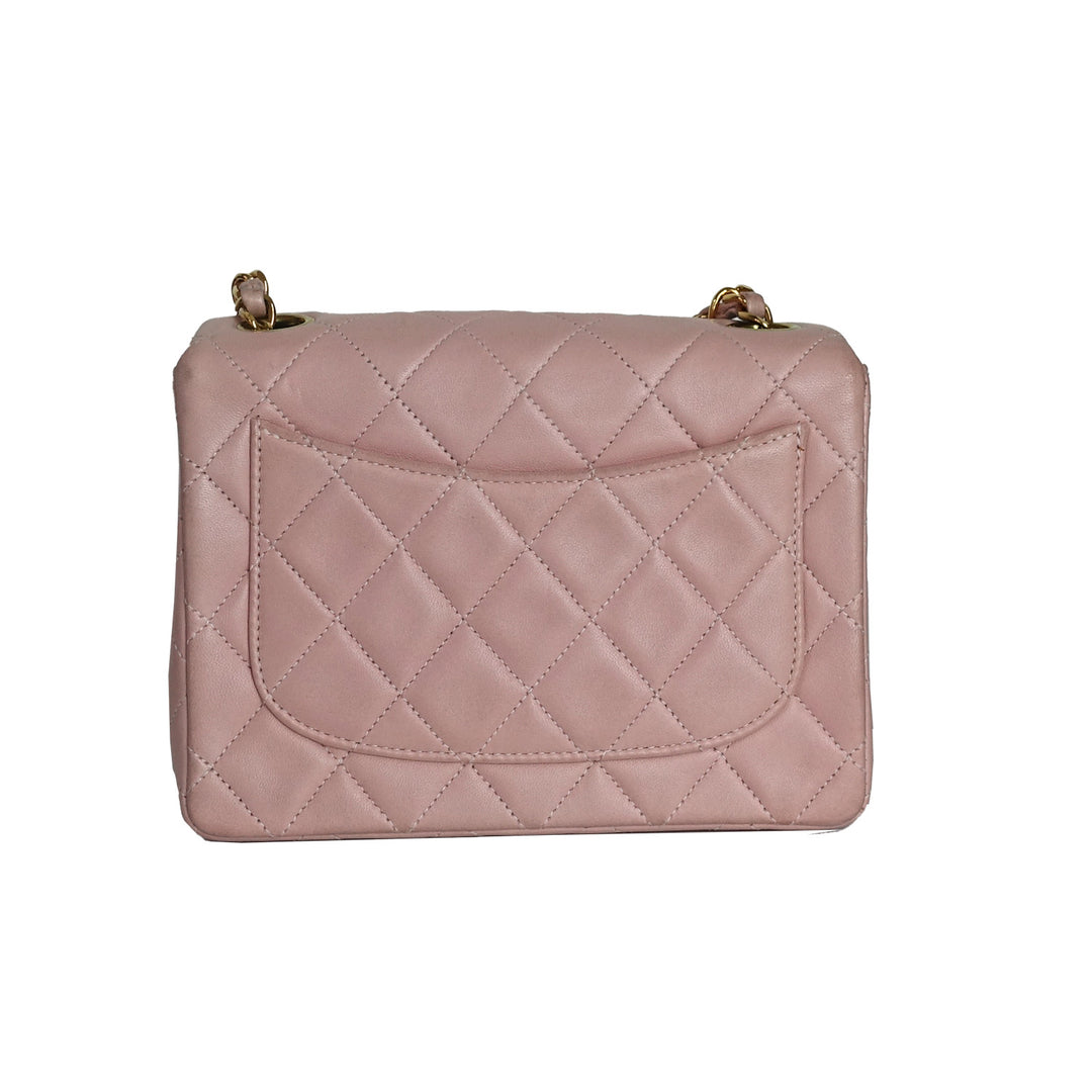 This vintage Chanel bag features a back slip pocket for your essentials. 